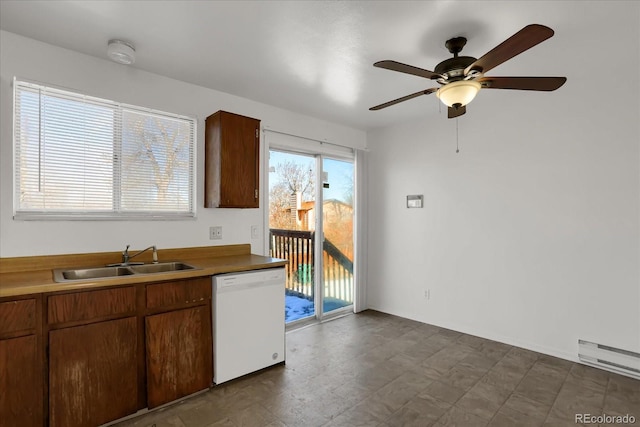 kitchen with sink, white dishwasher, baseboard heating, and ceiling fan