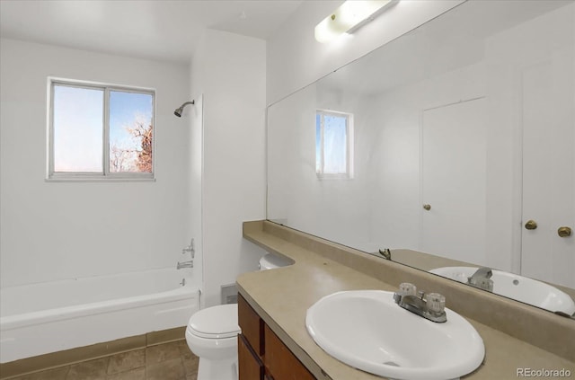 full bathroom with a healthy amount of sunlight, tub / shower combination, vanity, and toilet