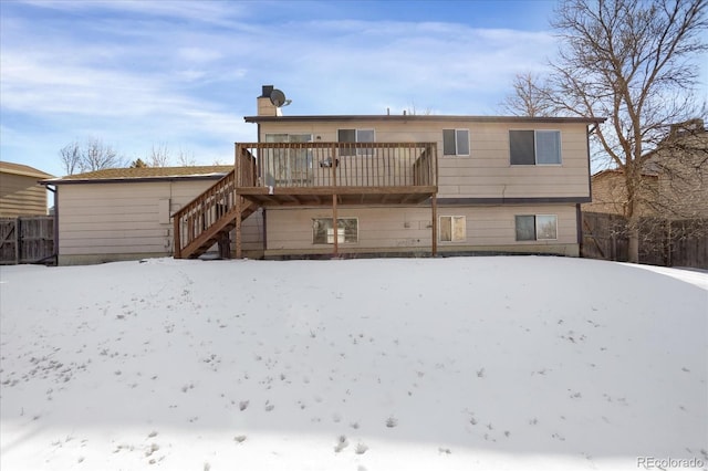 view of snow covered house