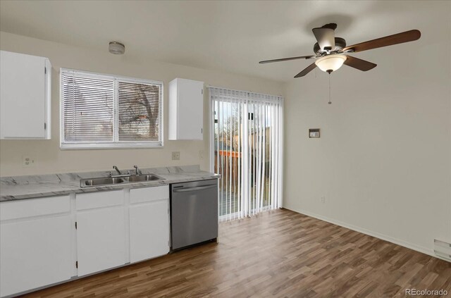 16651 E Arizona Pl, Aurora, CO 80017 - kitchen featuring stainless steel dishwasher, ceiling fan, wood finished floors, and light countertops