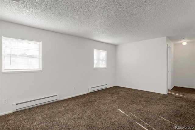 16651 E Arizona Pl, Aurora, CO 80017 - unfurnished room featuring a baseboard radiator, carpet flooring, and a textured ceiling