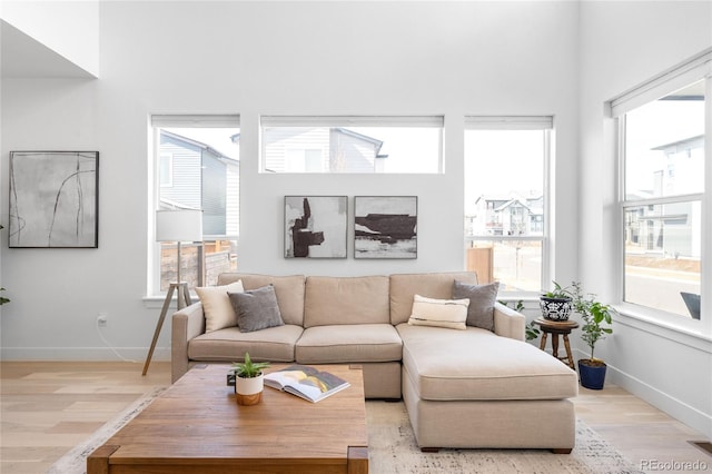 living room with wood finished floors and baseboards