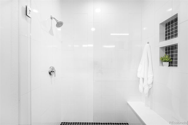 bathroom featuring tiled shower