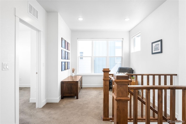 bedroom with light carpet, visible vents, recessed lighting, and baseboards