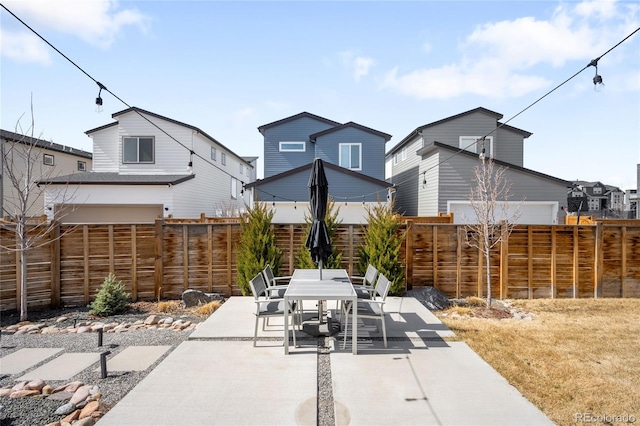 view of patio / terrace featuring outdoor dining space and a fenced backyard