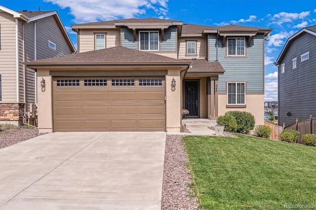 view of front of property with a garage and a front yard