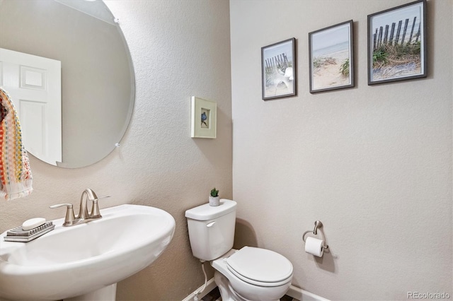 bathroom with toilet and sink