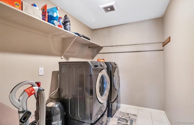 washroom featuring tile patterned flooring and independent washer and dryer