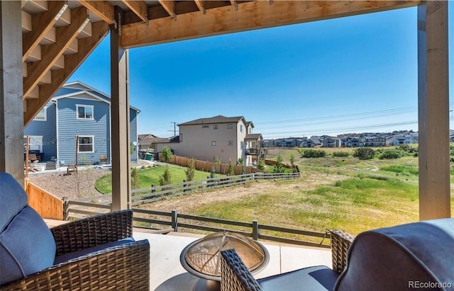 balcony featuring an outdoor living space with a fire pit and a patio