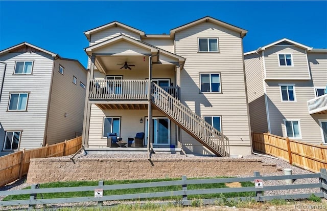 back of house with ceiling fan