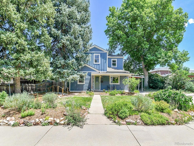 3282 Depew St, Wheat Ridge, CO 80212 - view of front of home with board and batten siding and covered porch