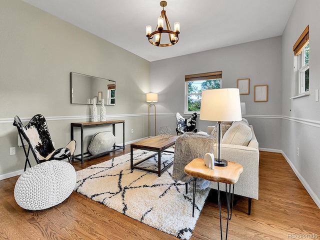 3282 Depew St, Wheat Ridge, CO 80212 - living room with plenty of natural light, a chandelier, and wood finished floors