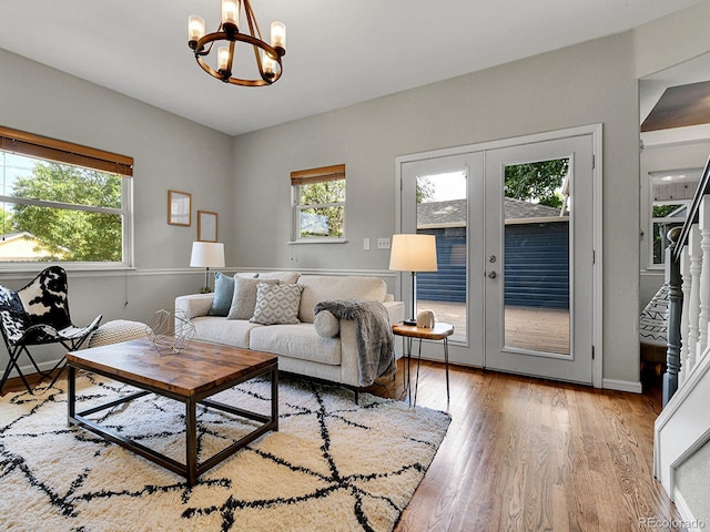3282 Depew St, Wheat Ridge, CO 80212 - living area with a chandelier, wood finished floors, and french doors