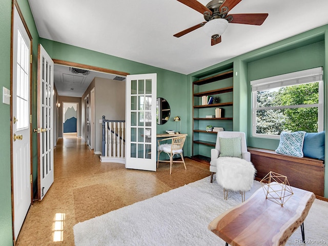 3282 Depew St, Wheat Ridge, CO 80212 - sitting room with built in shelves, a ceiling fan, attic access, and french doors