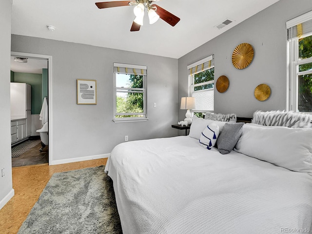 3282 Depew St, Wheat Ridge, CO 80212 - bedroom with multiple windows, a ceiling fan, and ensuite bath