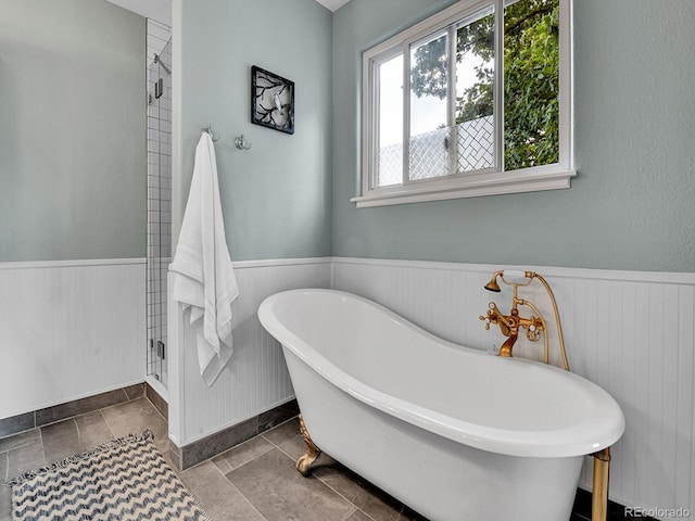 3282 Depew St, Wheat Ridge, CO 80212 - full bath with a wainscoted wall, a soaking tub, and wood walls