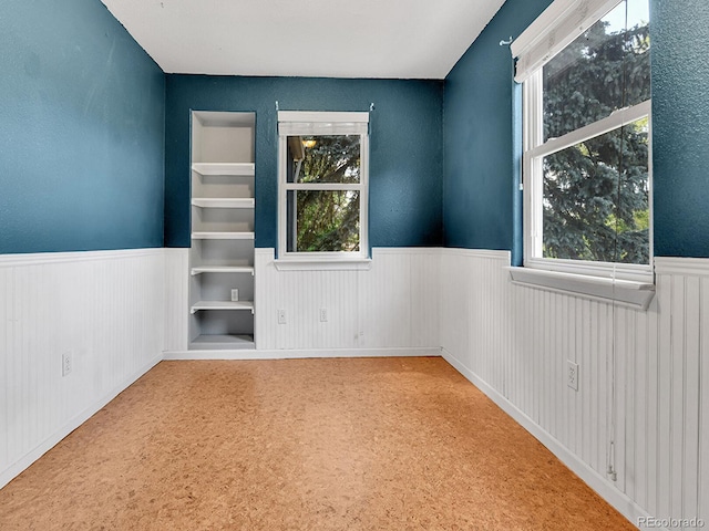 3282 Depew St, Wheat Ridge, CO 80212 - unfurnished room featuring a wainscoted wall and plenty of natural light