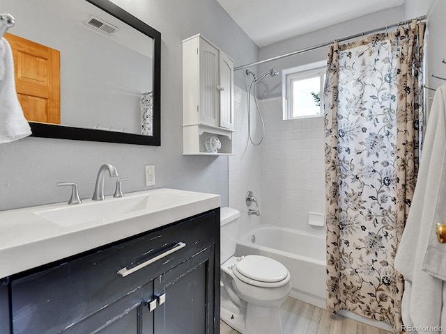 3282 Depew St, Wheat Ridge, CO 80212 - bathroom featuring vanity, shower / bathtub combination with curtain, and wood finished floors