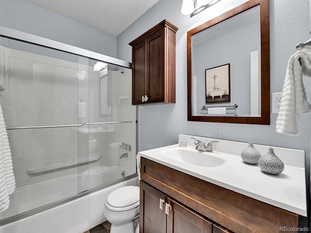 3282 Depew St, Wheat Ridge, CO 80212 - full bath featuring vanity, shower / bath combination with glass door, and a textured wall