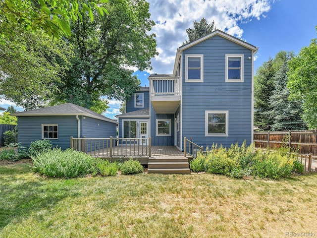 3282 Depew St, Wheat Ridge, CO 80212 - rear view of house with a balcony and a wooden deck