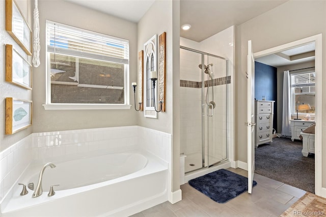 599 Fall River Ct, Brighton, CO 80601 - bathroom with a bath and a shower stall