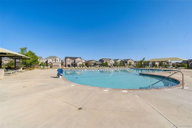 599 Fall River Ct, Brighton, CO 80601 - community pool with a residential view and a patio