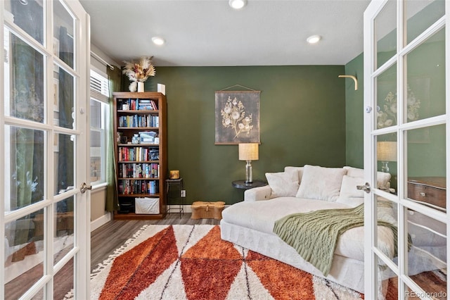 599 Fall River Ct, Brighton, CO 80601 - bedroom featuring french doors, wood finished floors, and recessed lighting