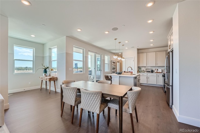 dining area featuring baseboards, dark wood-type flooring, and recessed lighting