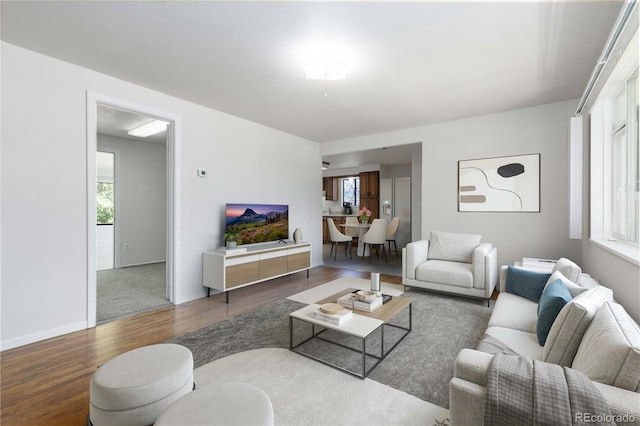 3955 S Hazel Ct, Englewood, CO 80110 - living area featuring wood finished floors and plenty of natural light