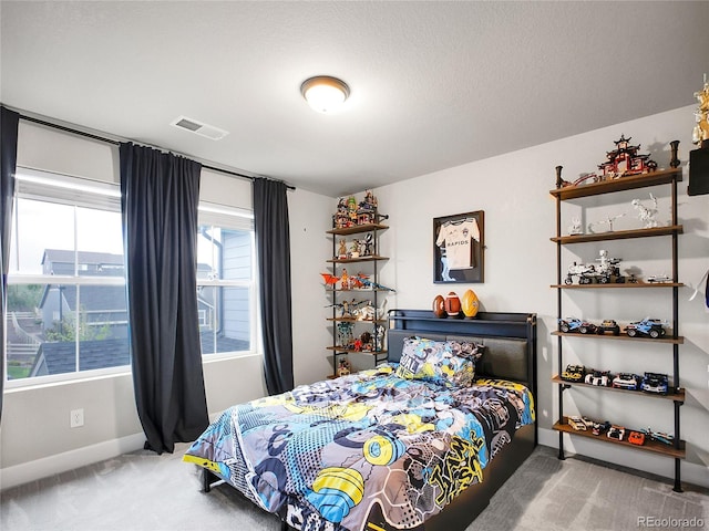 carpeted bedroom with baseboards
