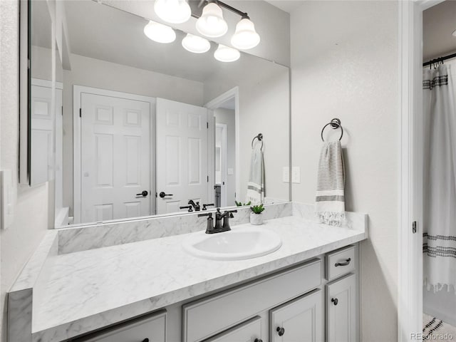 full bath featuring vanity