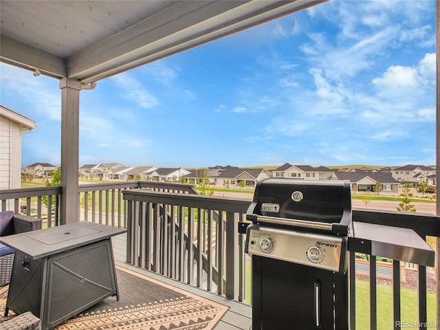 wooden deck featuring a residential view