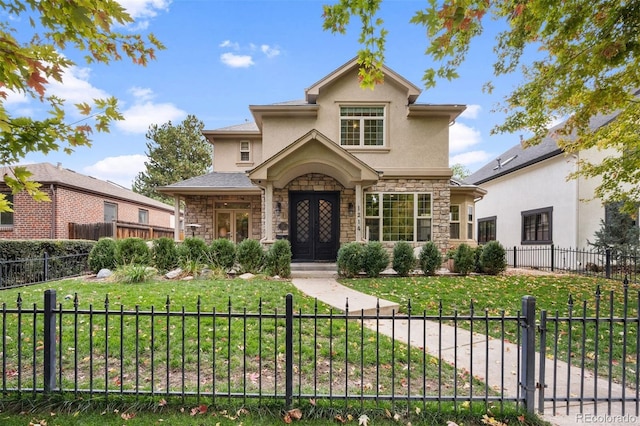 view of front of property featuring french doors and a front lawn