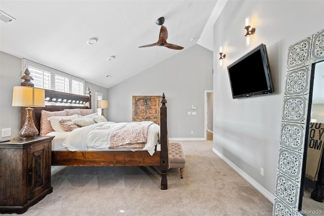 bedroom featuring light carpet, vaulted ceiling, and ceiling fan