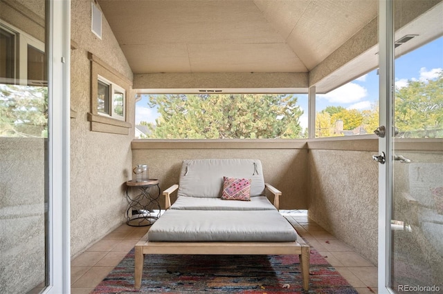 sunroom with french doors and lofted ceiling