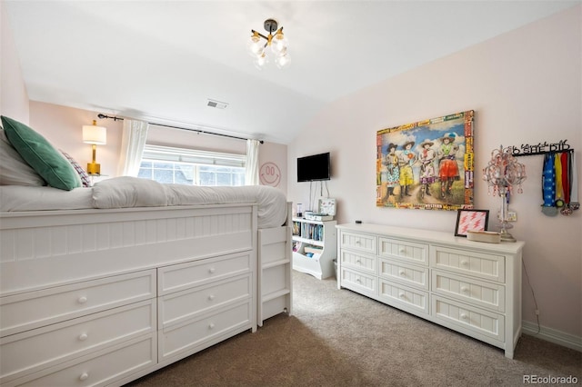 carpeted bedroom with vaulted ceiling