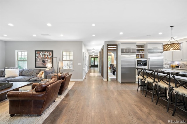 living room with light hardwood / wood-style flooring