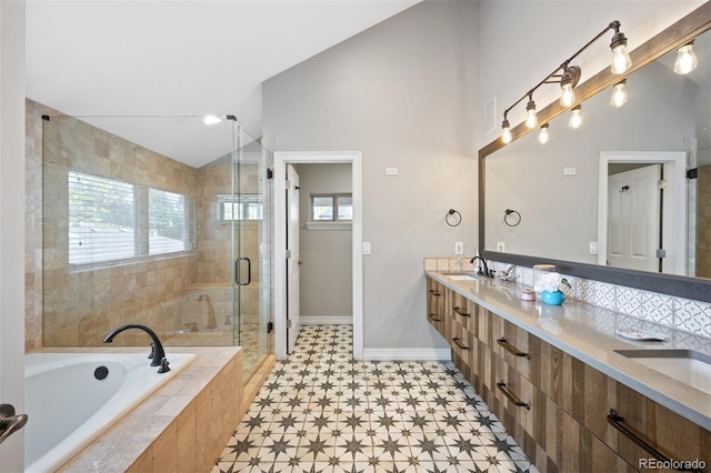 bathroom featuring vanity and shower with separate bathtub