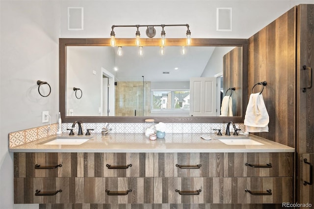 bathroom with vanity, an enclosed shower, and lofted ceiling