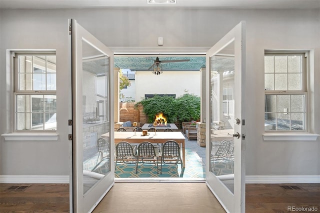 entryway featuring french doors, hardwood / wood-style flooring, and plenty of natural light