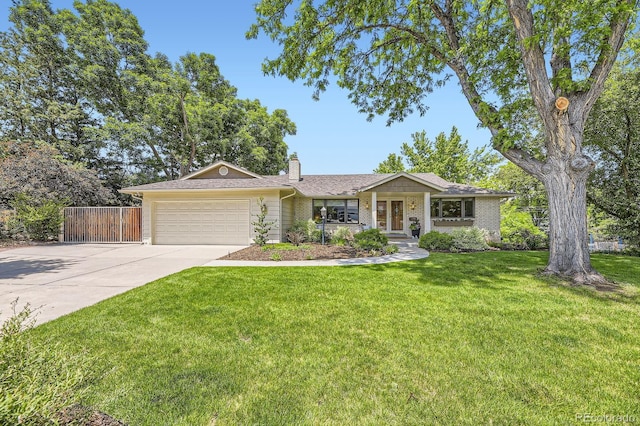 5475 W Ottawa Ave, Littleton, CO 80128 - single story home featuring a garage, concrete driveway, a chimney, and brick siding