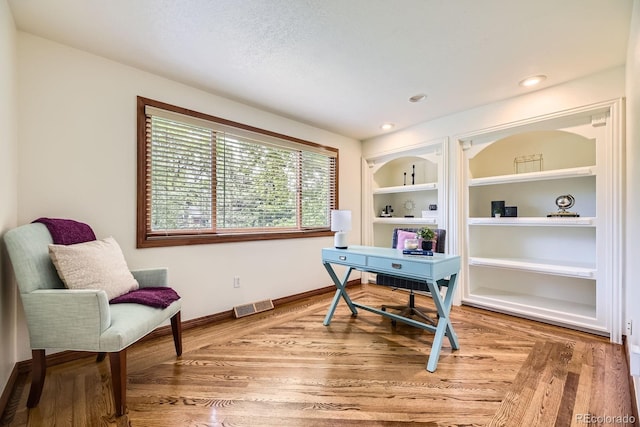 5475 W Ottawa Ave, Littleton, CO 80128 - office featuring built in features, baseboards, and light wood-style floors