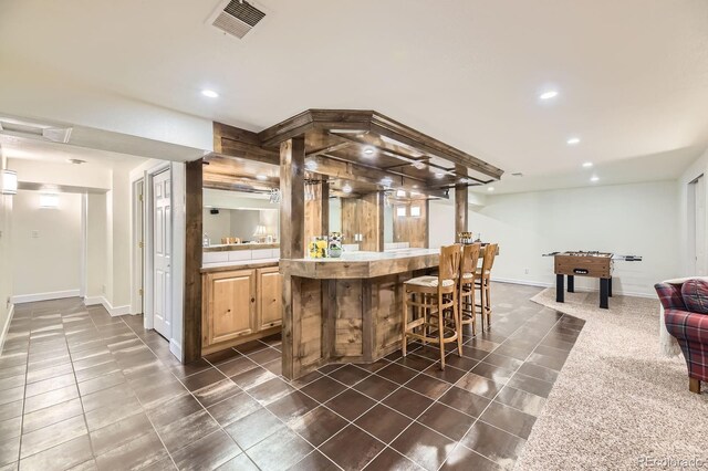 5475 W Ottawa Ave, Littleton, CO 80128 - indoor bar with dark tile patterned flooring, recessed lighting, and baseboards