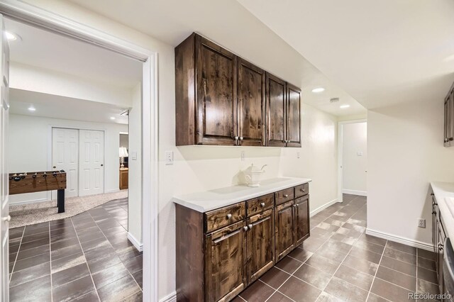5475 W Ottawa Ave, Littleton, CO 80128 - bar area featuring baseboards, dark tile patterned floors, and recessed lighting