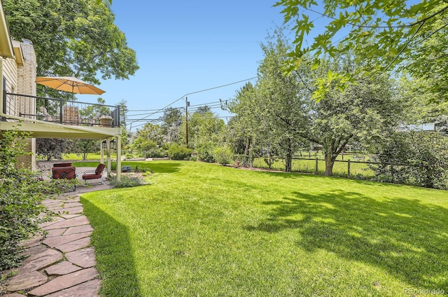 5475 W Ottawa Ave, Littleton, CO 80128 - view of yard featuring a patio area