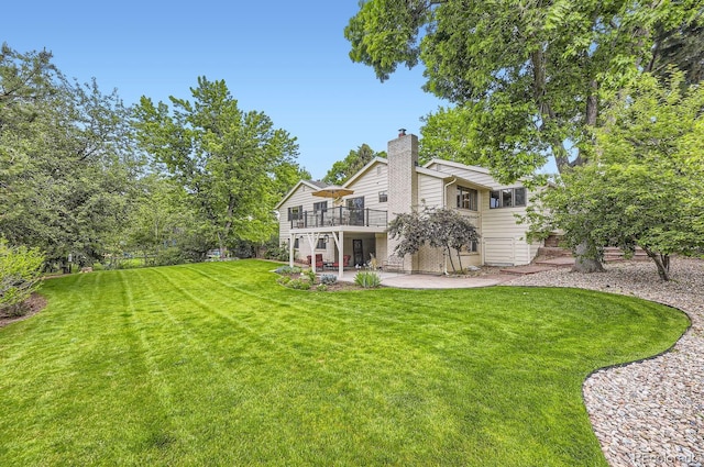 5475 W Ottawa Ave, Littleton, CO 80128 - rear view of property with a patio, a chimney, a yard, and a deck