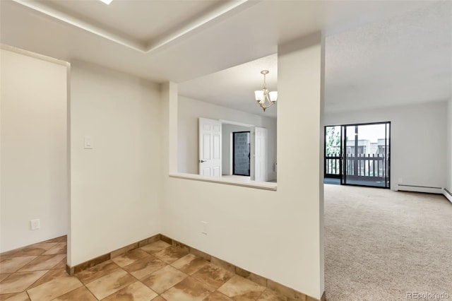 14001 E Marina Dr Unit 606, Aurora, CO 80014 - empty room featuring a chandelier, a baseboard heating unit, and baseboards