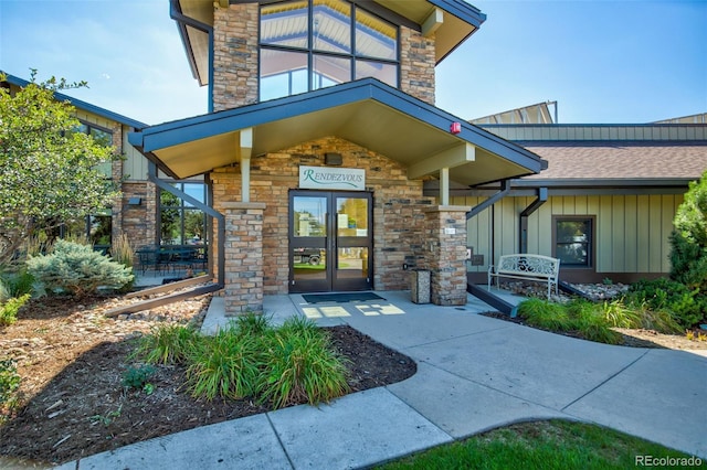 14001 E Marina Dr Unit 606, Aurora, CO 80014 - property entrance with stone siding, board and batten siding, roof with shingles, and french doors