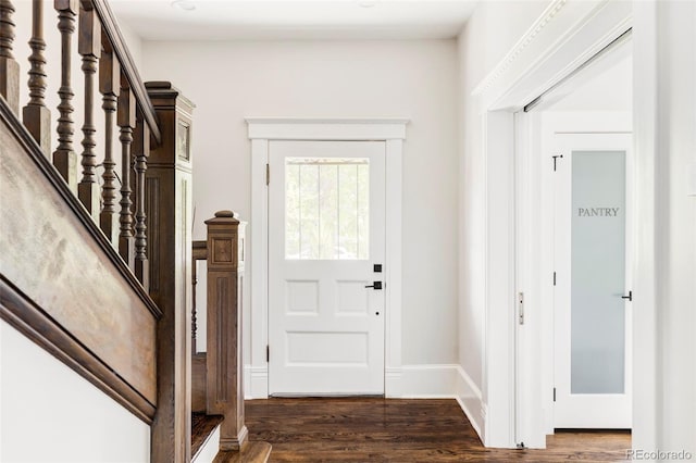 entryway with dark hardwood / wood-style floors