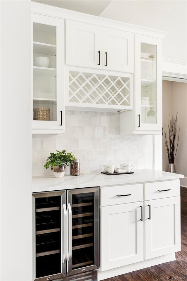 bar with white cabinets, backsplash, dark hardwood / wood-style floors, and wine cooler